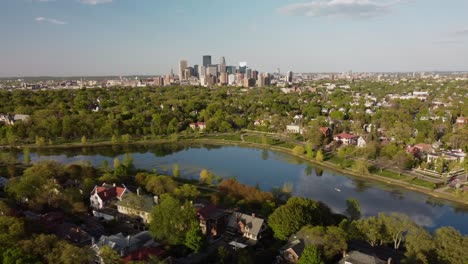 Drone-over-Lake-of-the-Isles-looking-towards-Minneapolis-on-a-summer-afternoon-4k