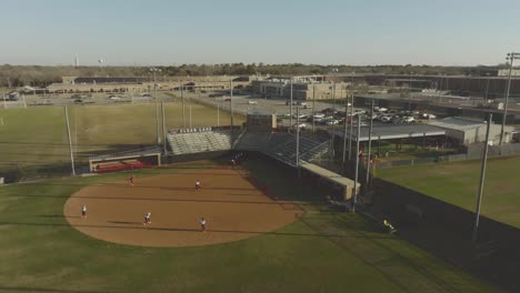 An-aerial-view-of-the-Clear-Lake-High-School-girls'-softball-team-practicing-at-the-CLHS-Campus-in-Clear-Lake,-Houston,-Texas