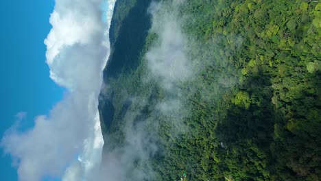 Clouds-moving-over-Green-Mountain-Landscape-Evergreen-Forest,-Rain-Water-Cycle-Ecosystem-Energy-Transition-Rainforest-Natural-Habitat-Species,-True-Vertical-4k-Video-Social-Media-9:16-Portrait