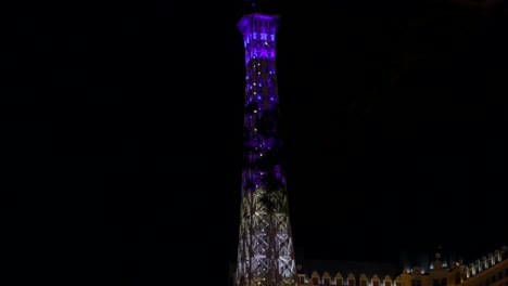 Colorful-illuminated-Eiffel-Tower-replica-at-Paris-Las-Vegas-Hotel-Resort-Casino-at-night
