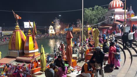 pov-shot-Many-people-are-sitting-watching-Ganga-Aarti-and-many-people-are-doing-darshan