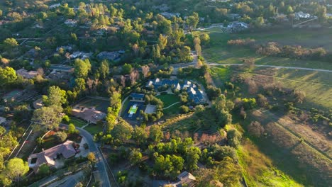 Drone-Flying-Over-Hidden-Hills,-Calabasas,-an-Exclusive-Neighborhood-in-Greater-Los-Angeles-Area,-in-Golden-Sunset