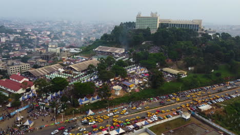 Aerial-tracking-shot-overlooking-the-Yafe-Yaounde-Festival-in-sunny-Cameroon