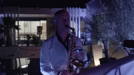 Close-up-shot-of-a-saxophonist-playing-music-live-to-guests-at-an-event