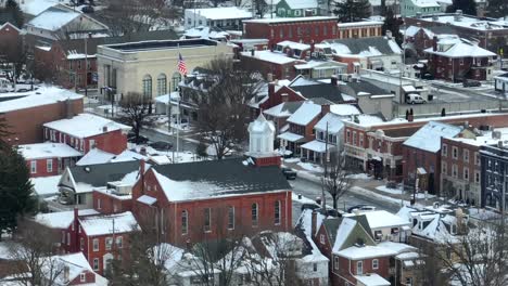 American-flag-in-Small-Town-USA-covered-in-winter-snow