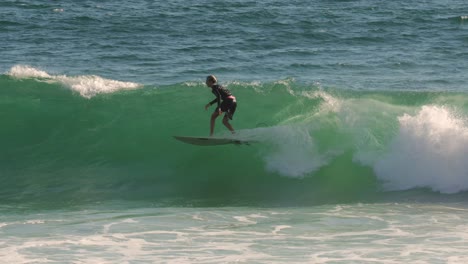 Surfer-enjoying-the-waves-on-a-sunny-day,-Burleigh-Heads,-Gold-Coast,-Australia