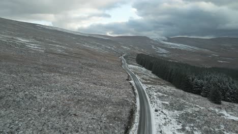 Road-Mountains-And-Conifer-Forest-On-A-Cloudy-Winter-Season-In-Wicklow,-Ireland