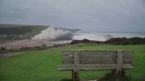 Empty-bench-overlooking-the-Seven-Sisters-on-a-cloudy-day