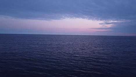 Drone-Shot-Over-the-Ocean---Purple-Sky-at-Dusk