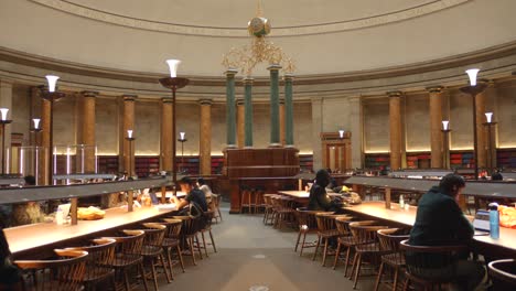 People-Reading-Inside-The-Wolfson-Reading-Room-At-Manchester-Central-Library-In-England,-UK