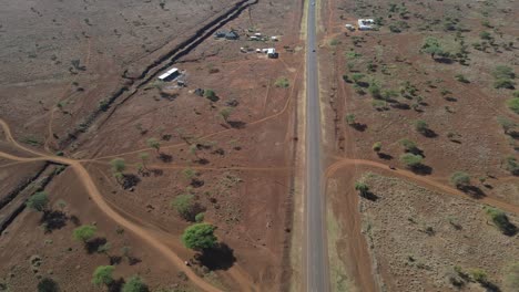 Modern-transportation-infrastructure,-asphalt-highway-in-Southern-Kenya,-aerial-view