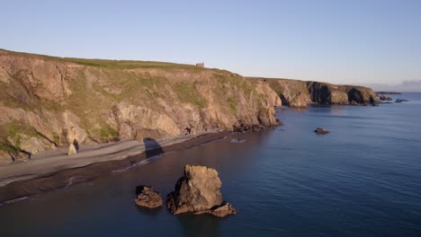Drone-flying-over-sea-and-cliffs-to-old-copper-mine-at-Tankardstown-Copper-Mines-Waterford-Ireland