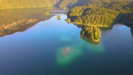 Aerial-Backward-Camera-View-Of-Eibsee-Lake-Near-Grainau,-Upper-Bavaria,-Bavaria,-Germay