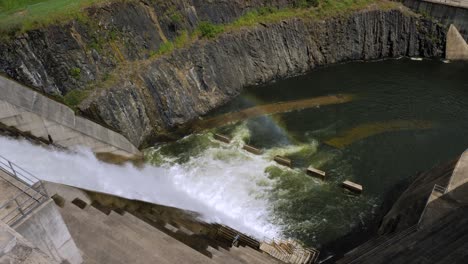 Gold-Coast,-Queensland,-Australia---01-21-2024:-Top-down-view-of-the-overflow-of-the-Hinze-Dam-due-to-excess-rain-in-the-Hinterland