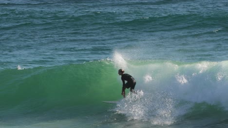 Surfers-enjoying-the-waves-on-a-sunny-day,-Burleigh-Heads,-Gold-Coast,-Australia