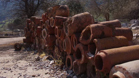 Wide-shot-of-a-stack-of-ancient-drainage-pipes-in-Ephesus