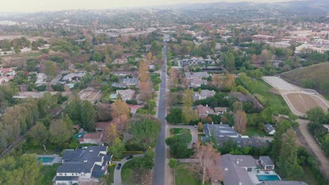 Hidden-Hills-Neighborhood-in-Calabasas,-California-in-Aerial-Drone-Shot-on-Sunny-Day,-Luxury-Homes-and-Pools-Below
