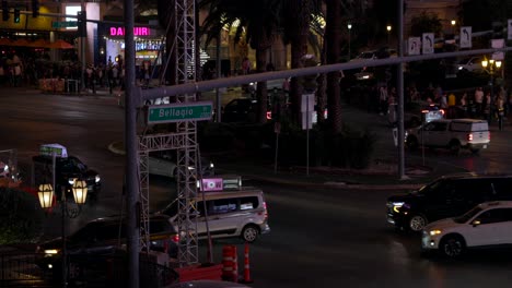 Slow-motion-high-angle-view-of-traffic-at-busy-intersection-in-Las-Vegas-at-night