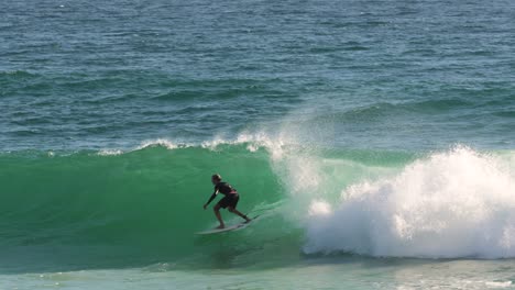 Surfer-enjoying-the-waves-on-a-sunny-day,-Burleigh-Heads,-Gold-Coast,-Australia
