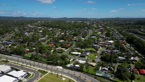 Reversing-aerial-view-of-Worongary-and-the-SkyRidge-residential-development-on-a-sunny-day,-Worongary,-Gold-Coast