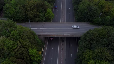 Overpass-over-a-Motorway-in-England,-Drone-shot