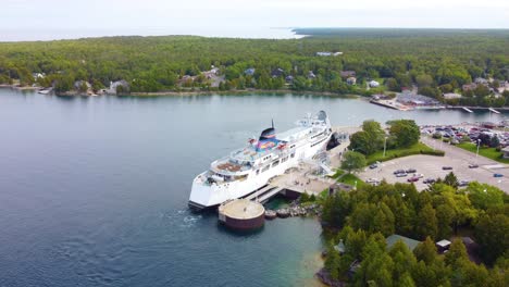 Aerial-of-River-cruise-ship-anchor-near-port-in-Georgian-Bay,-Ontario-Canada