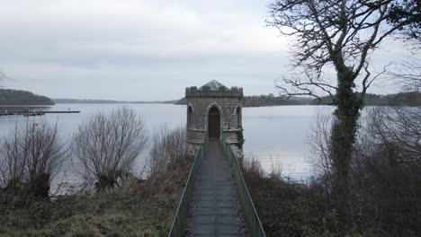Old-stone-structure-on-a-pier-at-Lough-Key,-Ireland,-historical-landmark,-daytime