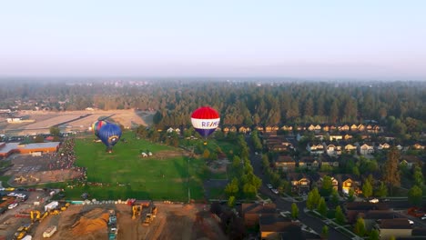 Remax-hot-air-balloon-gaining-altitude-at-the-Balloons-Over-Bend-event-in-Bend,-Oregon