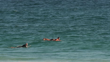 Surfers-waiting-for-waves-on-a-sunny-day,-Burleigh-Heads,-Gold-Coast,-Australia