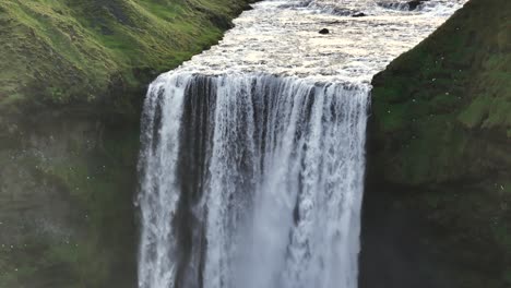 Skogafoss-Waterfall-Falls-on-Beautiful-Iceland-Morning,-Close-up-Aerial