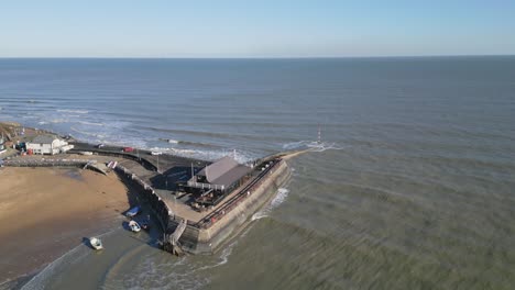 Drone-footage-of-Broadstairs-pier-and-beach-in-view