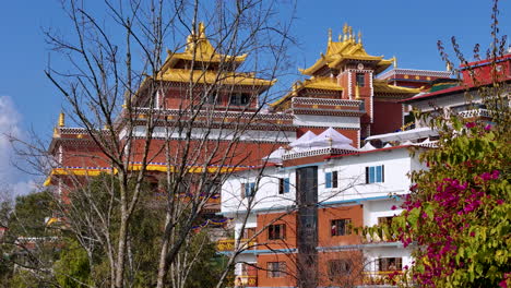 Colorful-environment-Namobuddha-Monastery-in-Dhuklikhel-Nepal,-Peaceful-sunny-weather-vibrant-nature-building-4K