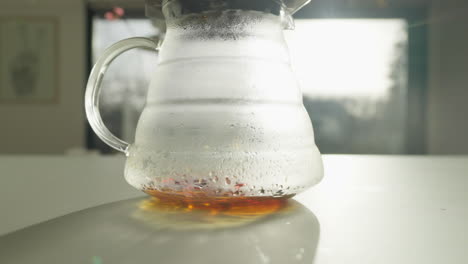 Glass-coffee-jug-with-freshly-brewed-coffee-in-morning-light