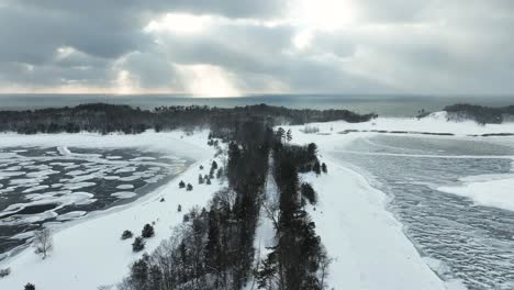 Aerial-above-Winnetaska-Road-leading-to-Lake-Michigan-during-a-light-flurry