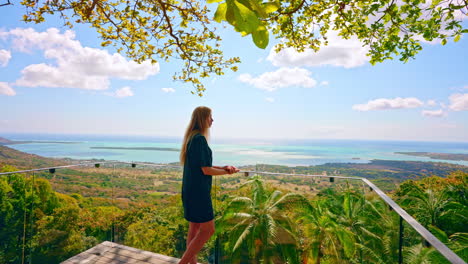 Slow-motion-back-shot-of-blonde-enjoying-the-panoramic-view-at-the-Mauritius-island