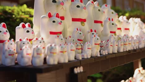 Gotokuji-Temple,-close-up-of-Hundreds-of-Lucky-Cat-Dolls-in-Tokyo-Japan-4k