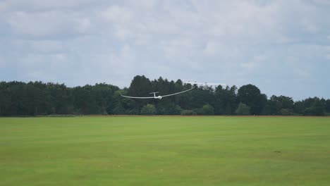 A-light-plane-tows-the-glider-high-up-into-the-stormy-sky-from-the-ground