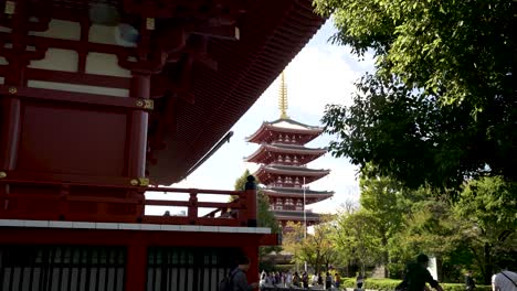 Daytime-captivating-view-unfolds-at-Tokyo's-Sensoji-Temple-with-its-Five-Storied-Pagoda,-encapsulating-the-essence-of-cultural-heritage-and-tradition-in-Japan