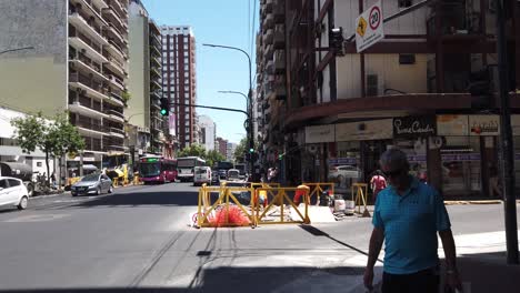 Workers-at-Rivadavia-Avenue,-street-asphalt-road-repairment,-security-clothes