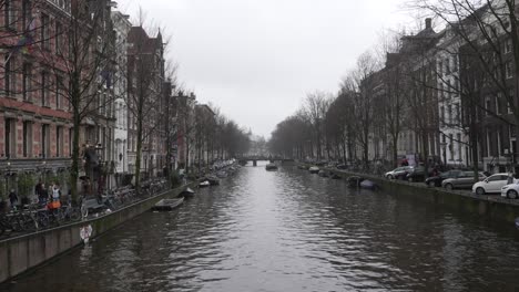 Amsterdam-static-shot-of-city-canal-in-city-center-neighbourhood