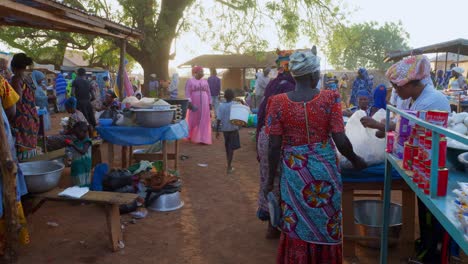 waman-wearing-traditional-african-tribe-clothing-walking-in-local-market-stand