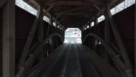 Drone-flying-through-a-covered-bridge-in-Lancaster-County,-Pennsylvania