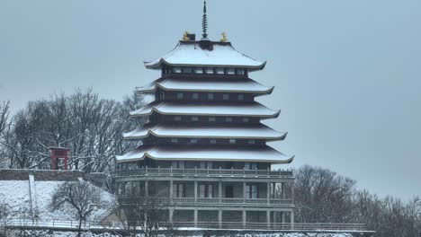 Aerial-shot-of-the-Reading-Pagoda-covered-in-snow