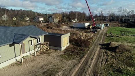 Men-are-Constructing-Simple-Houses---Wide-Shot