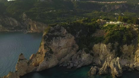 AERIAL-flight-reveals-the-rugged-Corfu-coastline-and-Paleokastritsa-landscape