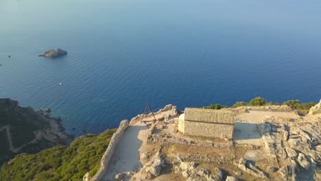 Angelokastro-hilltop-fort-on-Ionian-island-Corfu,-Dramatic-REVERSE-REVEAL