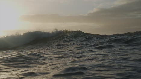 waves-crashing-with-sun-behind