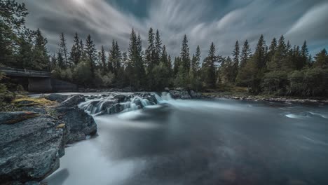 A-long-exposure-video-of-the-shallow-mountain-river-with-a-small-waterfall
