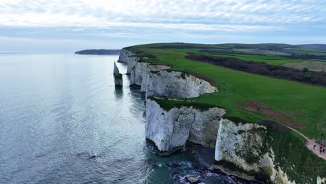 Aerial-view-flying-along-the-Steep-White-Cliffs-of-old-Harry-Rocks
