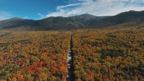Aerial-View-Of-Autumn-Forests-And-Rural-Road-in-New-England---Drone-Shot
